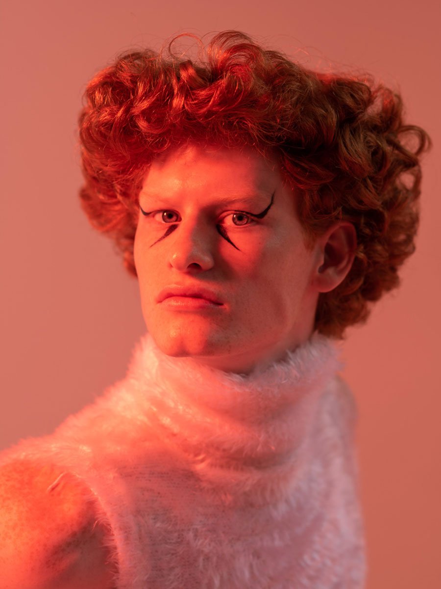Portrait of a man with red hair and red light