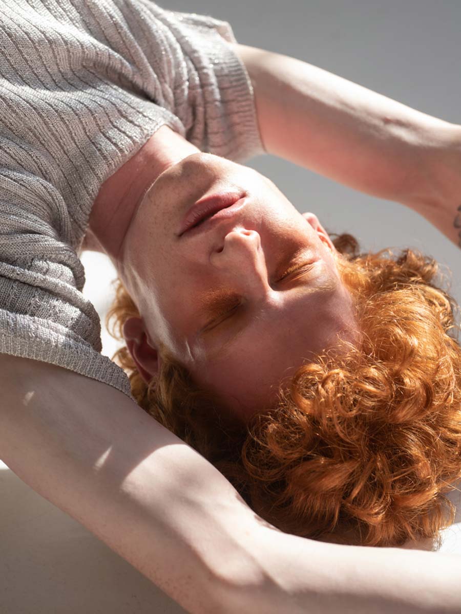 Portrait of an upside down man with red hair