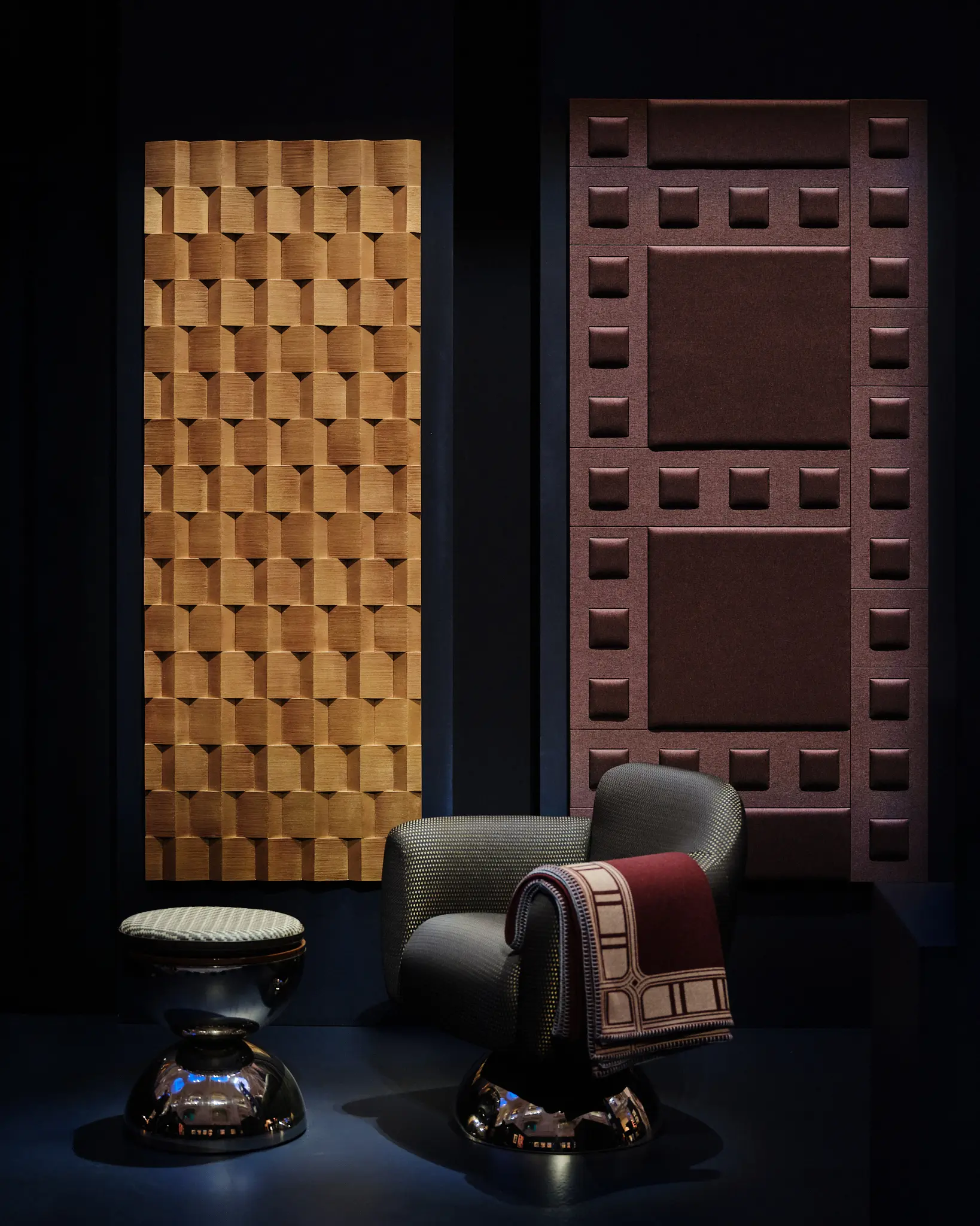 Textures of Art Déco — Forms in Dialogue Exhibition display featuring geometric wall panels, a sculptural chair, and modern fabric inspired by the Orient Express design language.