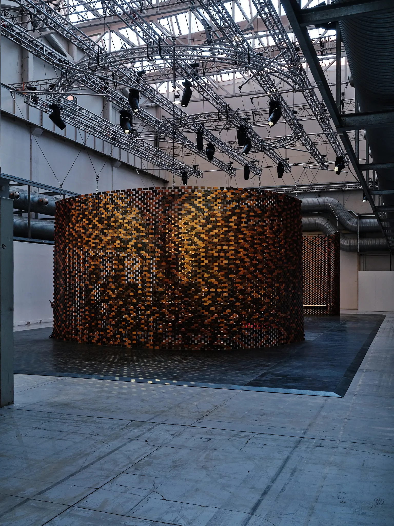 Saint Laurent × Charlotte Perriand Installation — Milan Design Week 2025 Wide view of the Saint Laurent Charlotte Perriand installation inside an industrial exhibition space in Milan