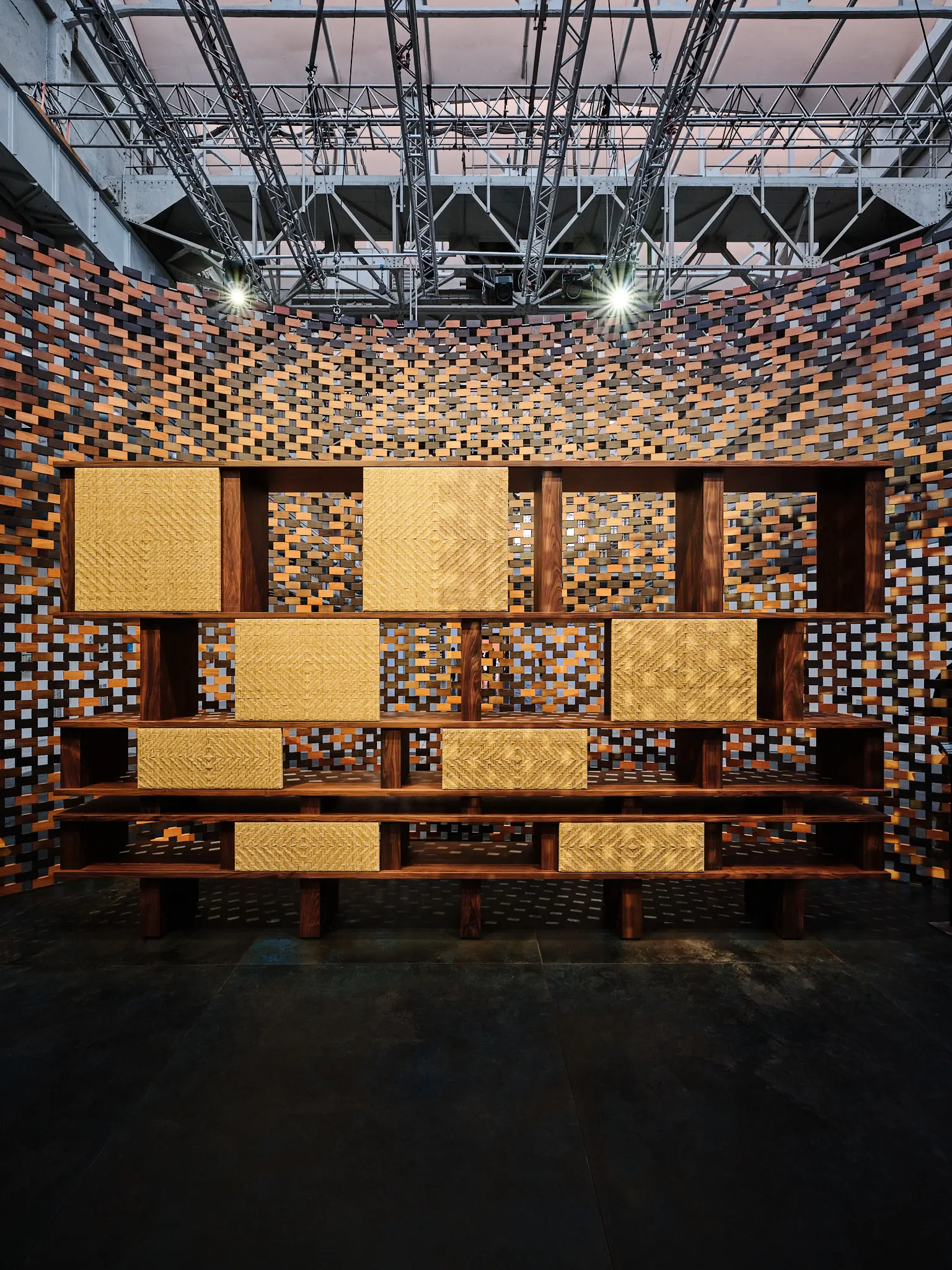 Saint Laurent × Charlotte Perriand — Symmetry and Structure Symmetrical view of Charlotte Perriand shelving framed by woven wooden walls