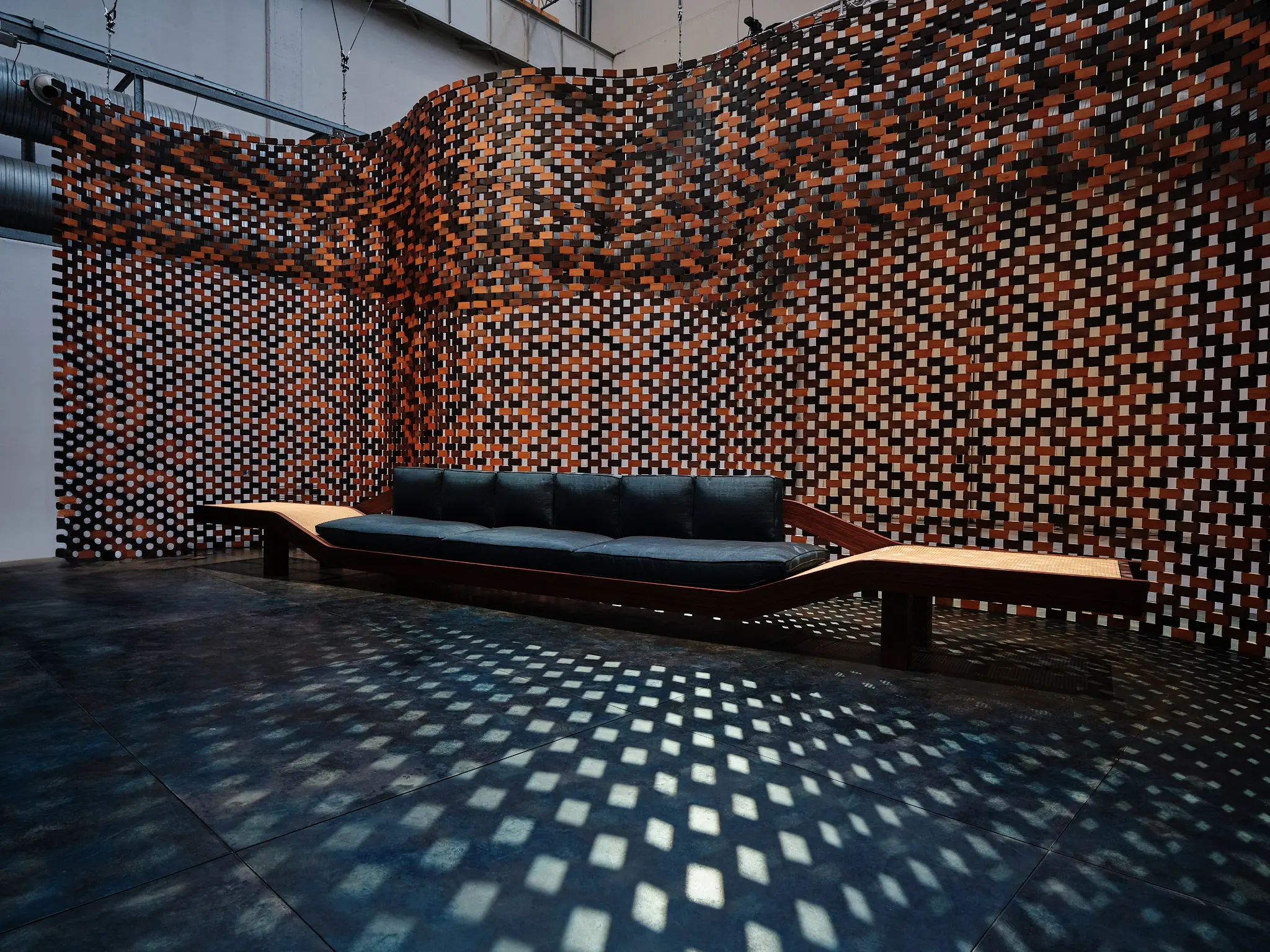 Charlotte Perriand Sofa — Saint Laurent Milan Design Week 2025 Sofa designed by Charlotte Perriand displayed inside the Saint Laurent installation at Milan Design Week